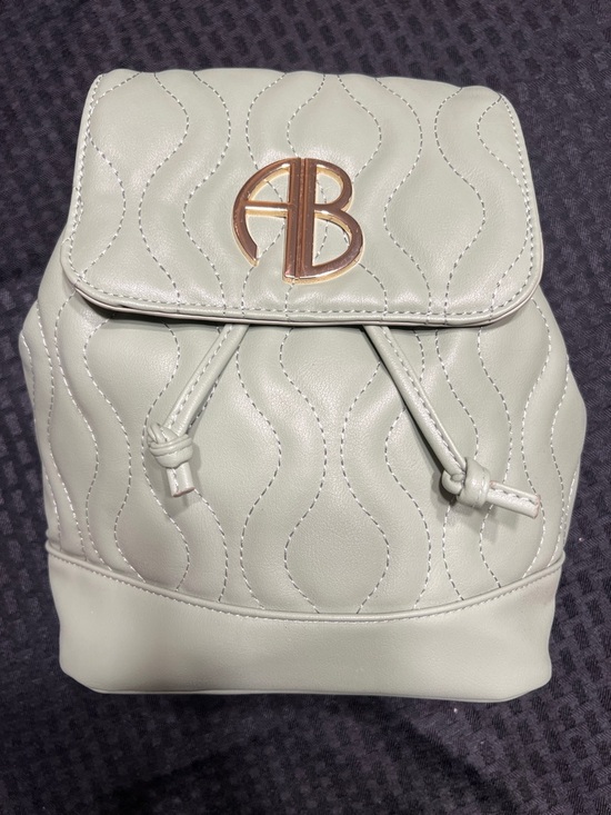 AB Studio Handbags - Alexis Bendel Light Sage Quilted Mini Drawstring Backpack with Gold Logo
